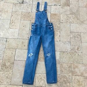 Ripped jean overalls